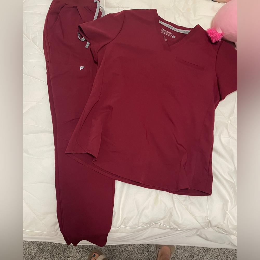 Fabletics scrubs. Wine colored. Top size MEDIUM , and bottoms size SMALL/SHORT